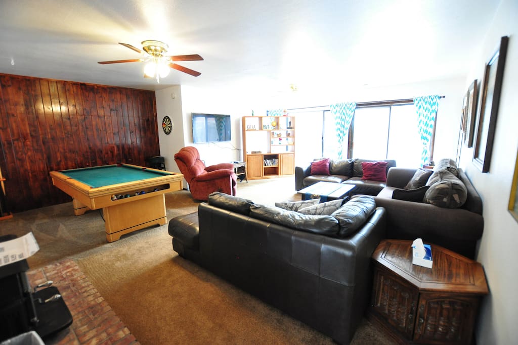 huge spacious living room looks over the spacious fenced in back yard