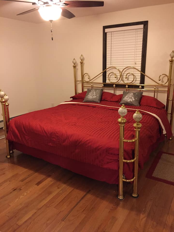 Master bedroom has a beautiful brass king size bed! Relax in bed watching HBO on the 42" TV also in master bedroom. 