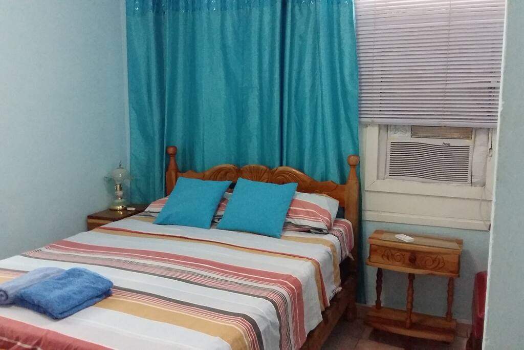 The room, equipped with a bed an AC