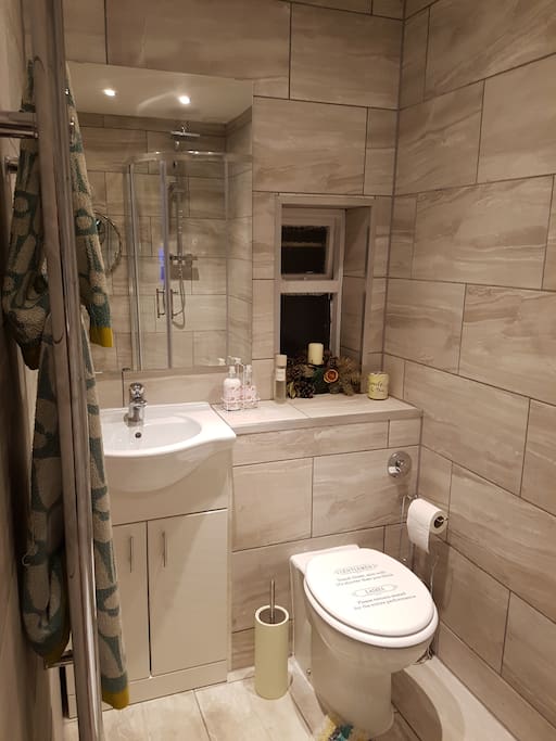modern bathroom with shower toilet and wash basin