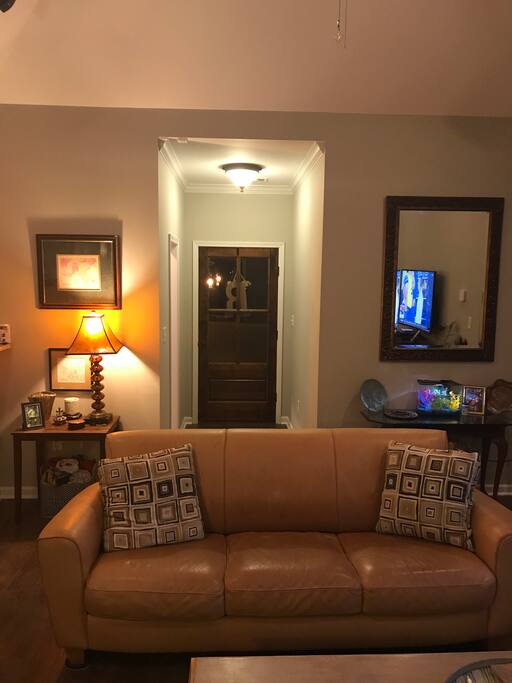 Front door entrance to foyer and wet bar.