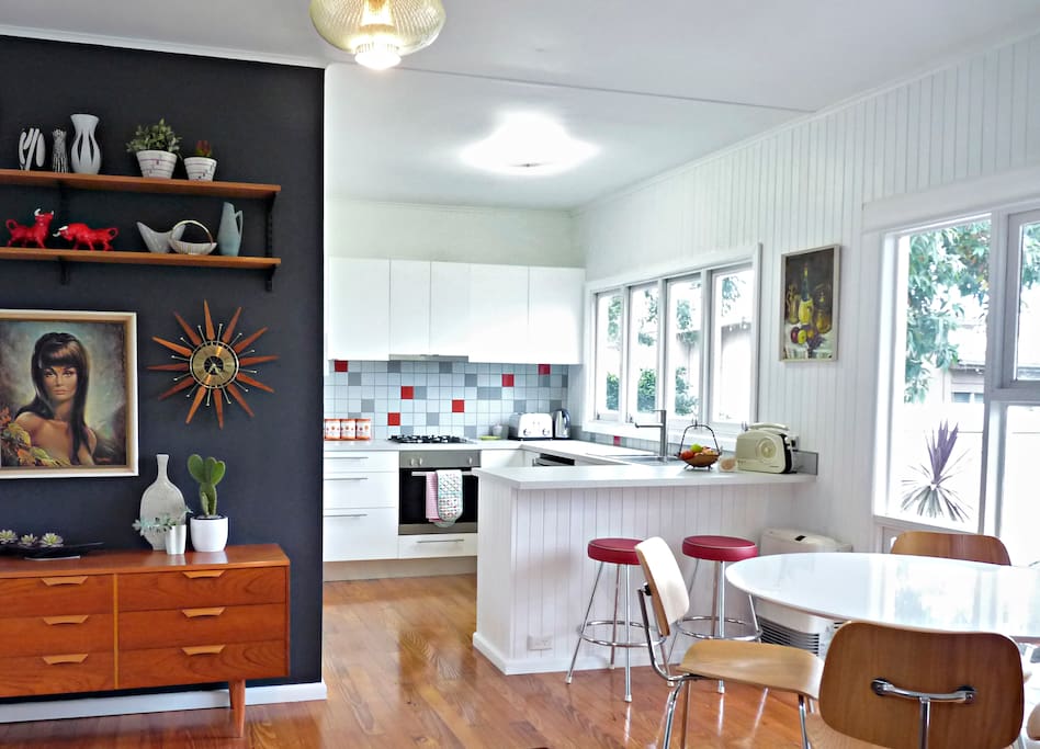 Open plan living/kitchen/dining area with mid-century decor