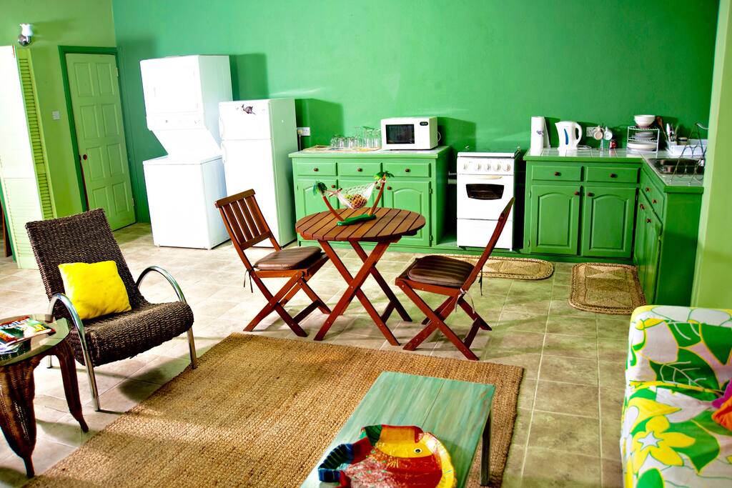 Kitchen is fully loaded with latest appliances including washing machine & dryer