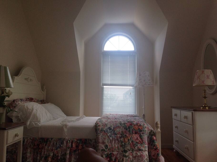 West side bedroom with queen and twin bed along with dresser and armoire. Accommodates up to three guests.