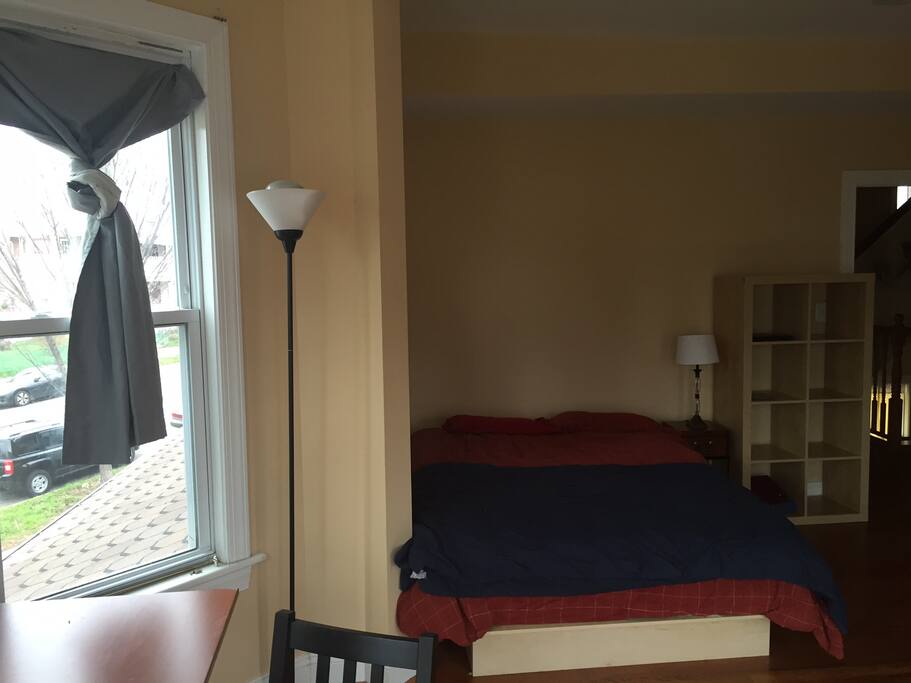 Comfortable full size bed with clean sheets and blankets