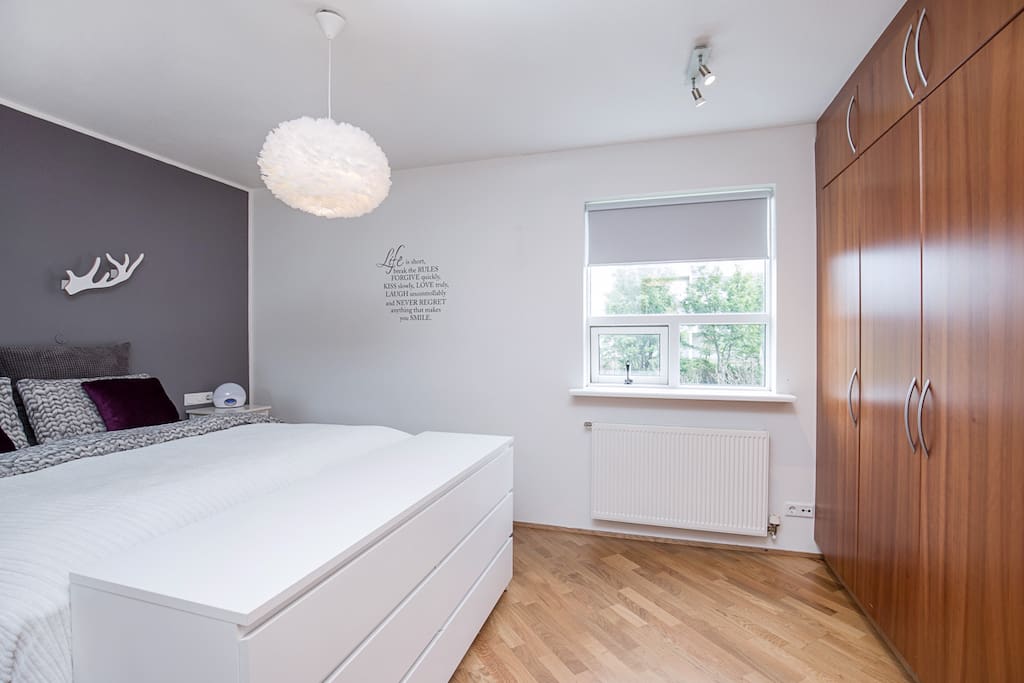 Master bedroom with a double bed and good closet space.