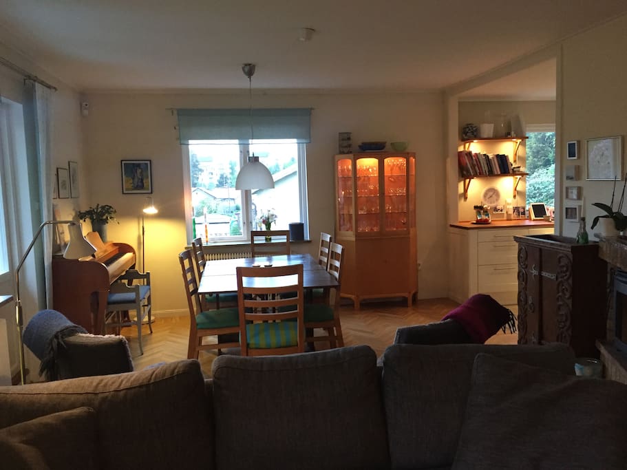 Dining area connecting kitchen and living area in open layout