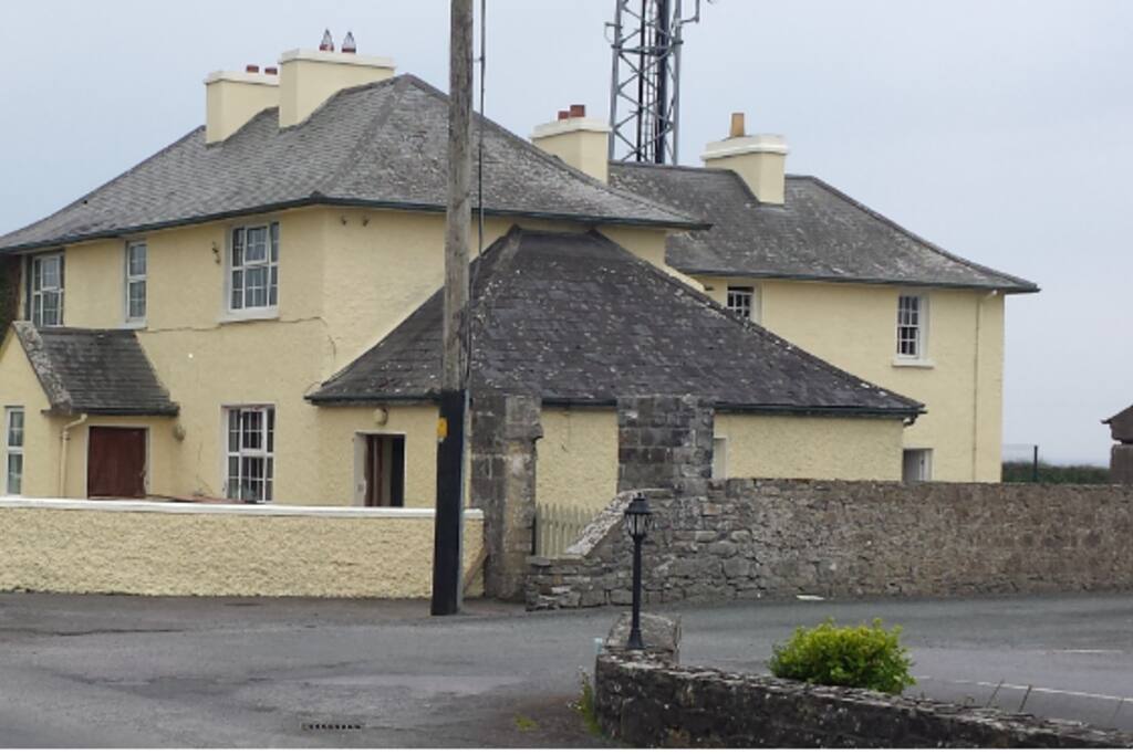 The Apartment is to the right of the building, it is the former Garda Station. There is ample parking to the rear of the property.