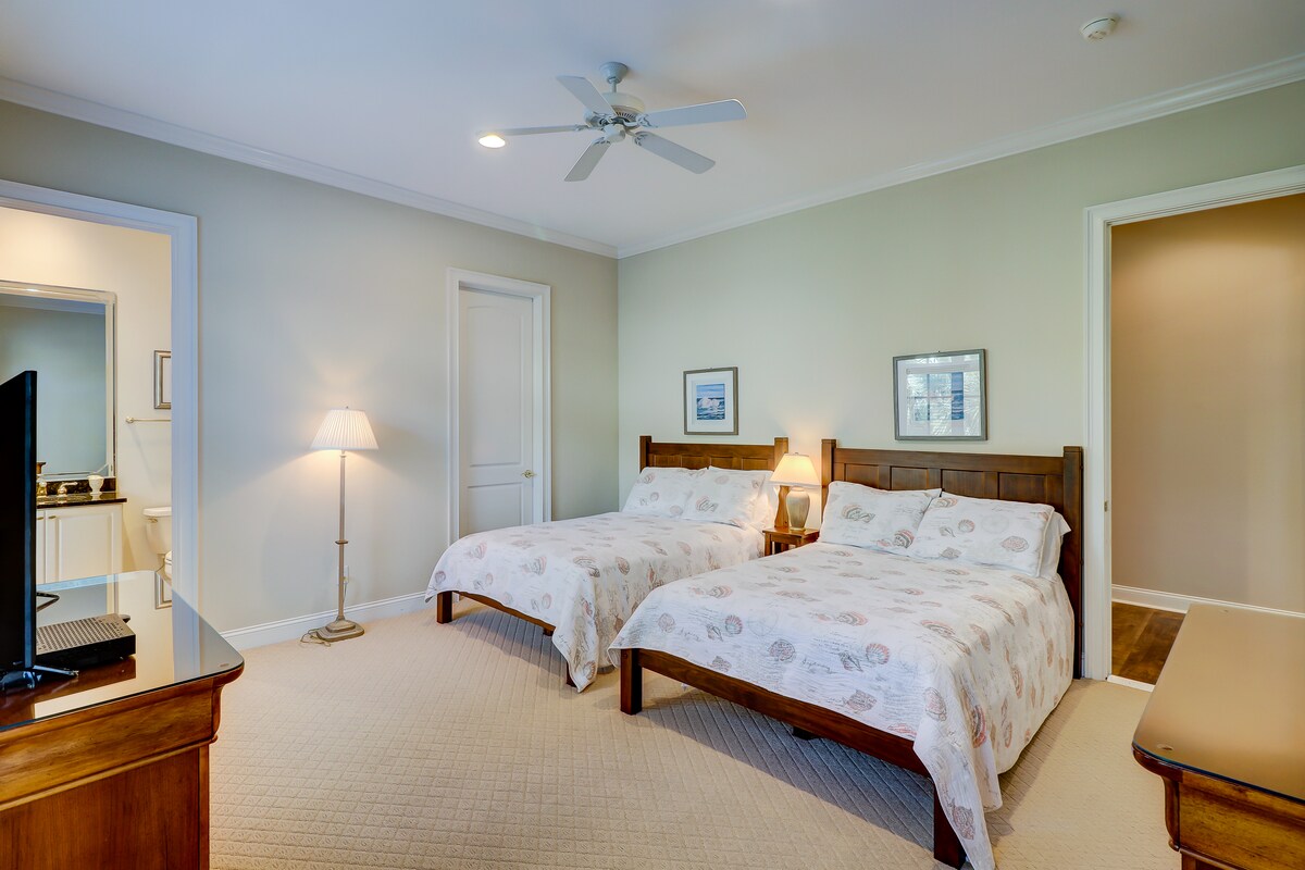 The third bedroom on main level features two full beds, walk-in closet and ensuite bath.