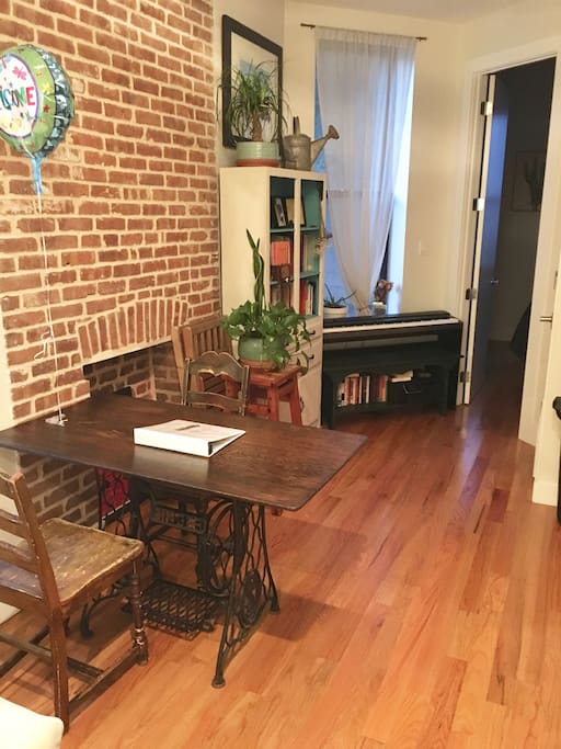 Hardwood floors and exposed brick give our apartment warmth and charm.