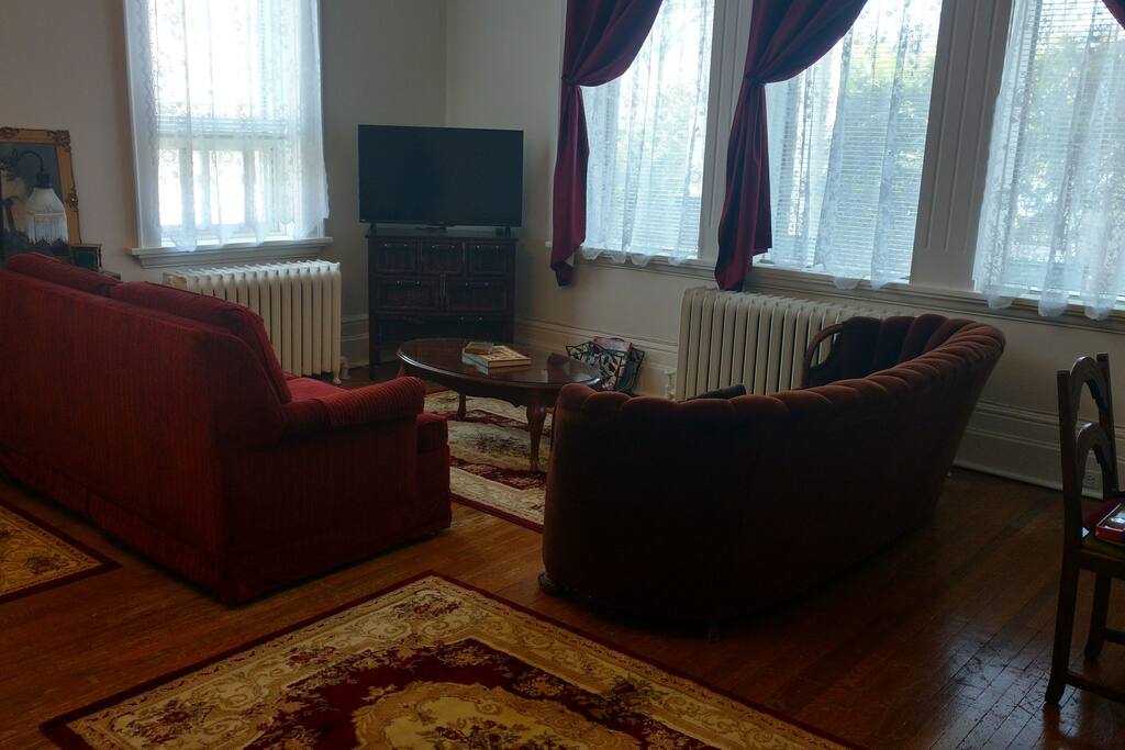 Your private "home suite home"! Living room of Parlor has 4 large windows.