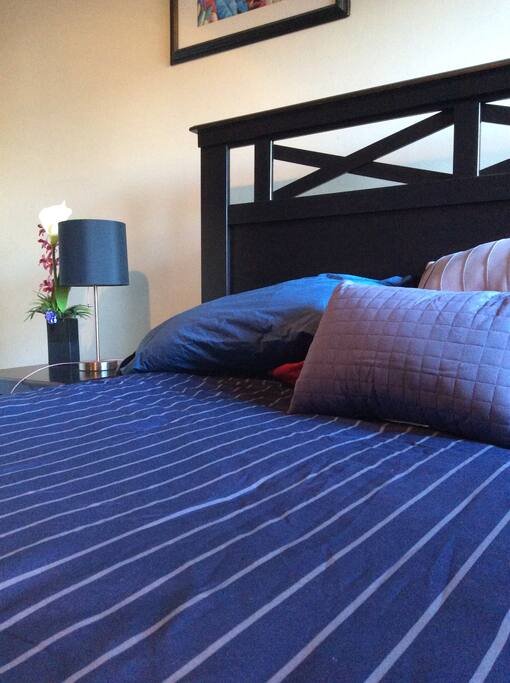 Queen Bed and comfortable armchair