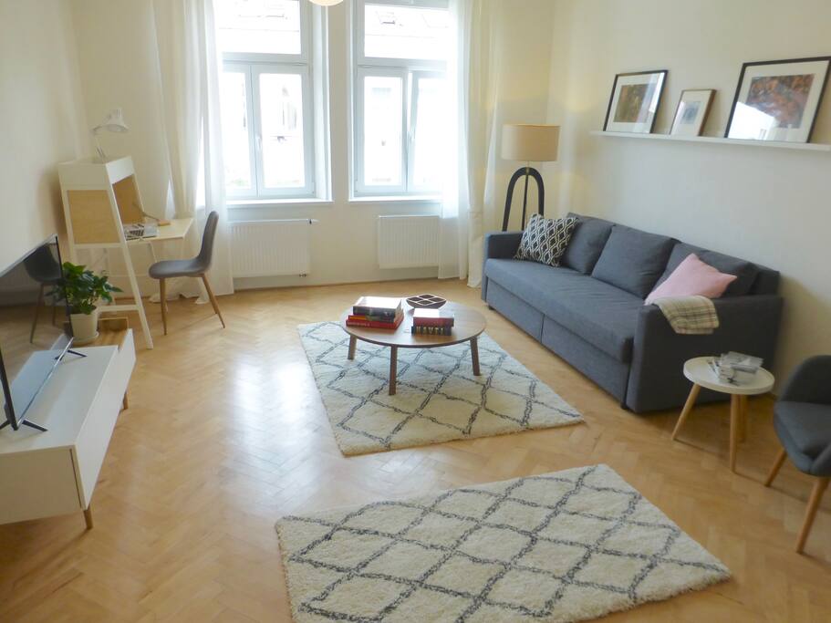 Entering the remodeled and newly furnished living room. Plenty of natural light for everyone. Double curtains dim the light when desired...
