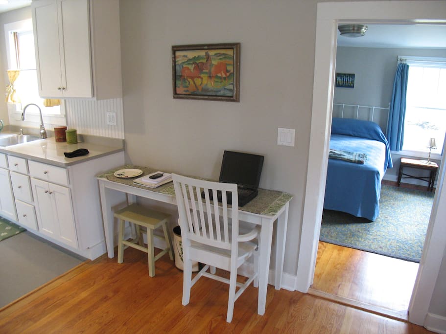 Shaker-style table doubles as eat-in counter and computer station.