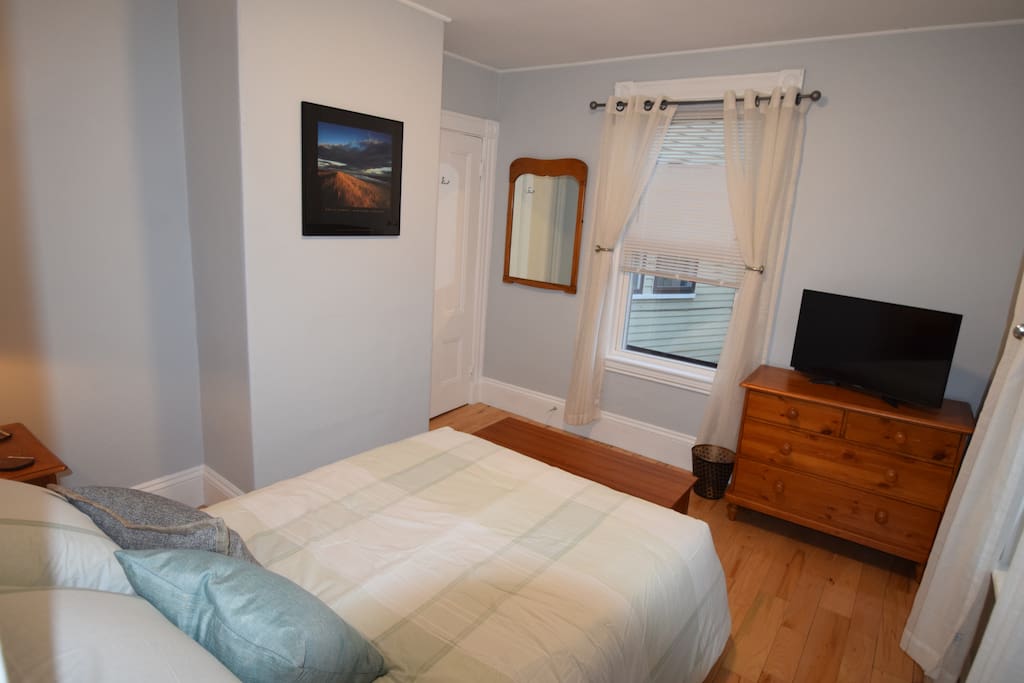 Blinds keep the morning light out and luxurious curtains give you privacy when you want light streaming in. Matching bureau and hanging mirror. 40 inch HDTV with Cable and Netflix included.