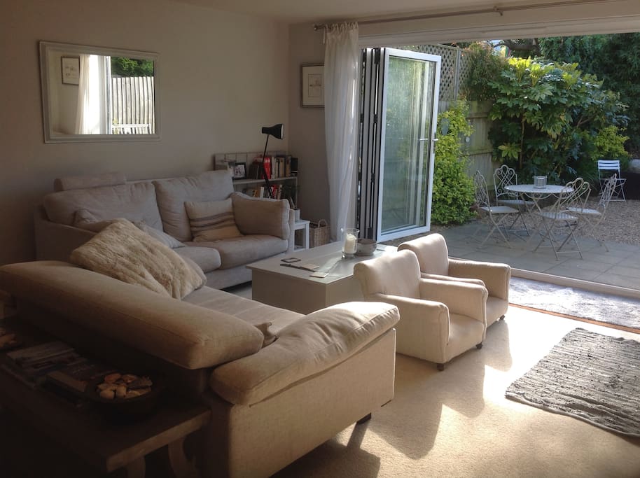 Open plan living area with bifolding doors