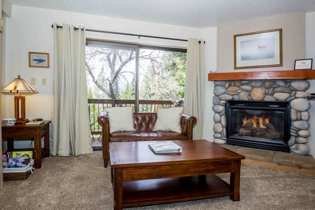Your living & dining area with seating, gas fireplace, TV & DVD player.