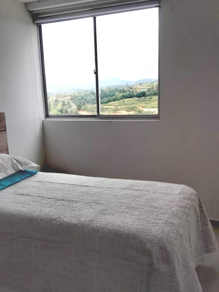 Room with single bed, TV, large closet, black out curtain. 