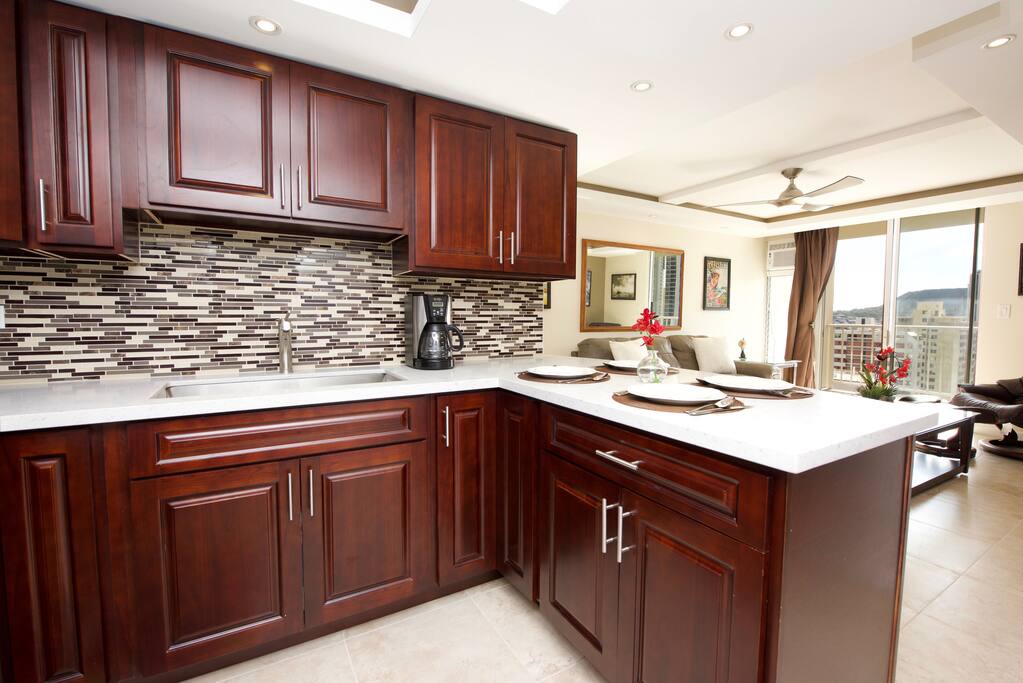 Welcome to our quiet 2 bed, 2 bath condo with an assigned parking stall in sunny Waikiki. The building is a 7 minute, 0.25 mile walk to Waikiki Beach. This is a high-floor unit with great views facing towards Diamond Head. From the lanai you can see from the ridges that form Manoa Valley to the ocean. The bedrooms both have queen-sized beds. The living room has a queen-sized sofa bed and a floor mattress. There is air conditioning and ceiling fan in every room.