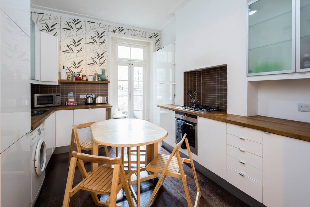 The table and chairs can be folded away to create more space, if needed.