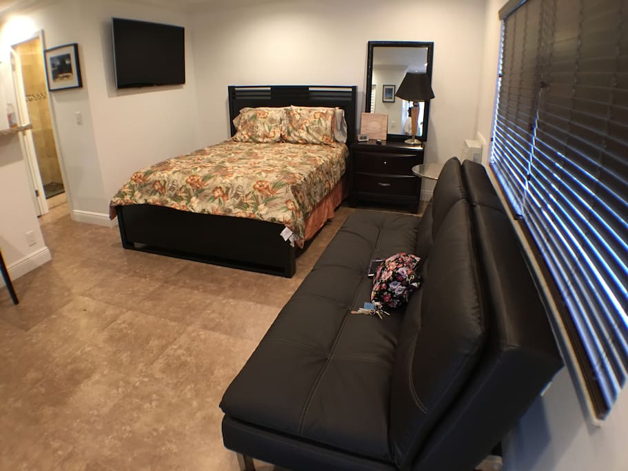 This extravagant queen sized bed will welcome you right home.