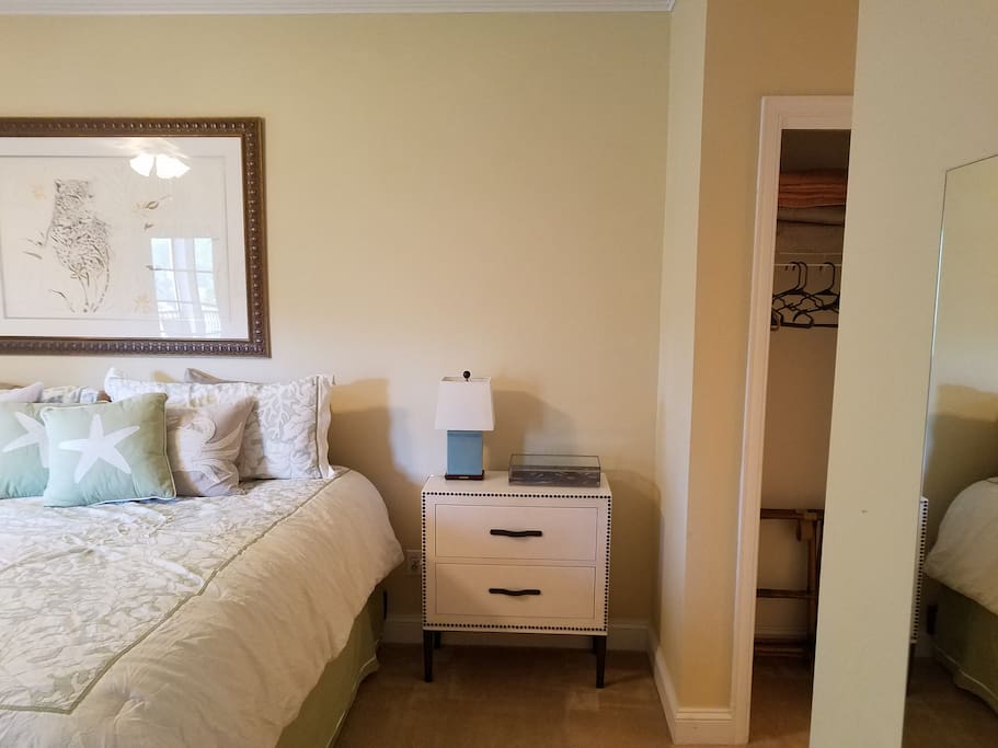 Master bedroom with extremely comfortable mattress, sitting area near windows, and walk-out screen porch. Flat screen television with Verizon FIOS. Plus master has shower, soaking tub, and double sinks.