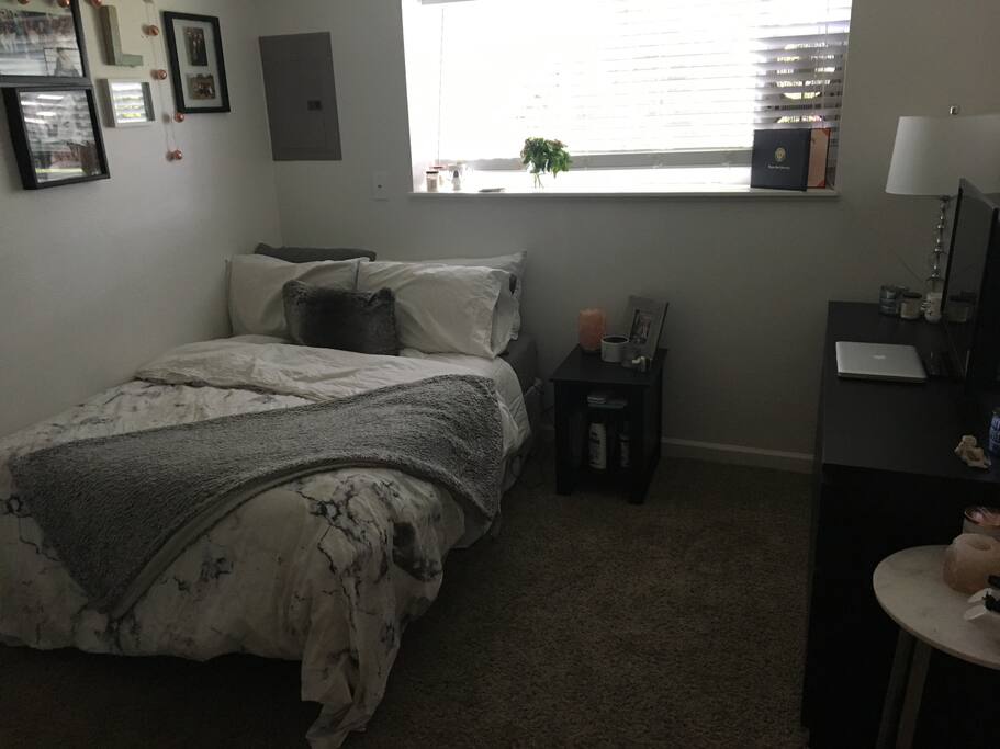 Bedroom with full mattress, and TV set up with Netflix
