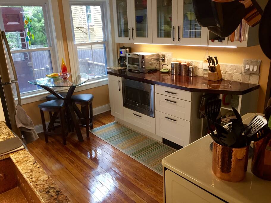 Eat-in kitchen, microwave and counter convection oven/toaster. Mahogany counter. Overhead fan.