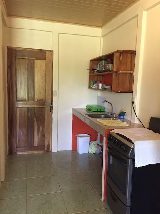 Kitchen has everything you need to cook a meal. Stove, oven and refrigerator included.