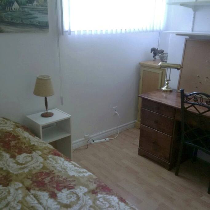 Bedroom with wide sunny window