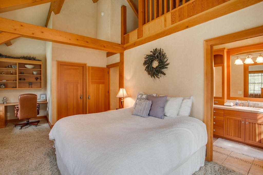 Main floor bedroom with king bed, private bathroom & shared shower/tub