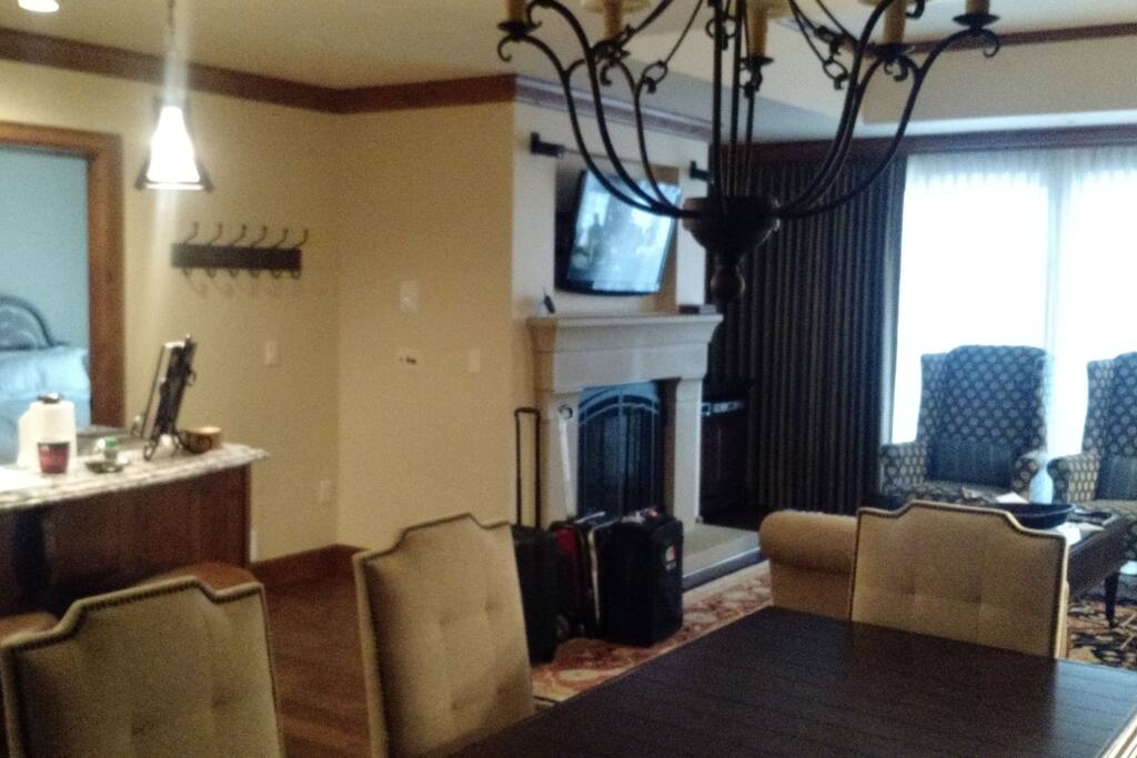Kitchen, Living Room and Dining Room with balcony and Fireplace.