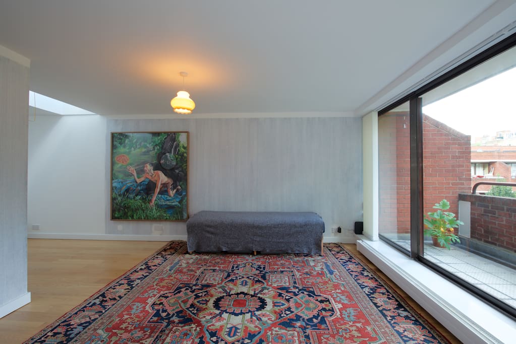Living room, balcony. Bedroom is round the corner, left.