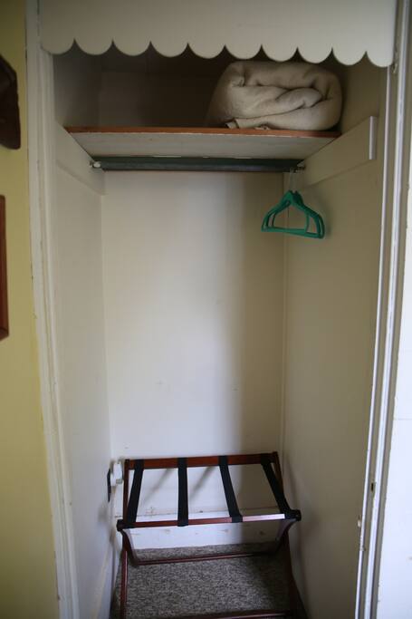 closet with luggage rack