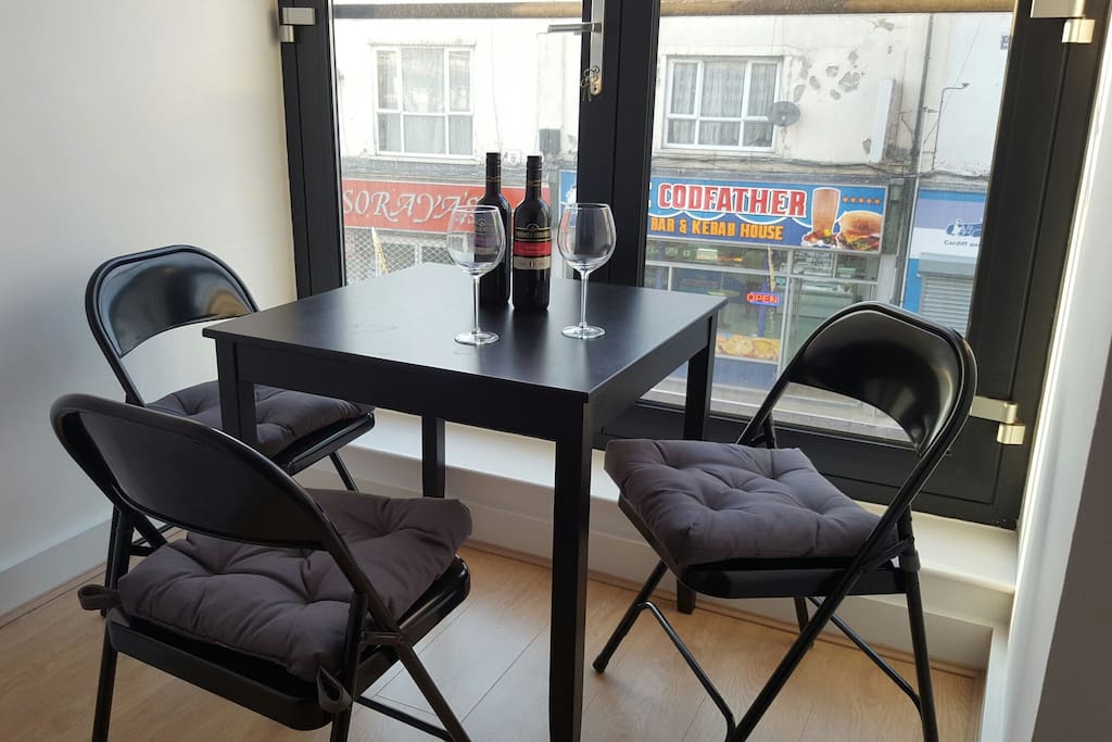 Cute dining area with a large Juliette balcony