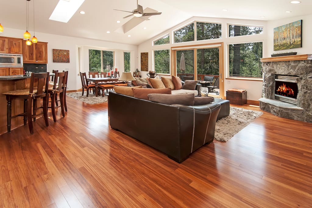 Living room with a fireplace and lots of natural sunlight
