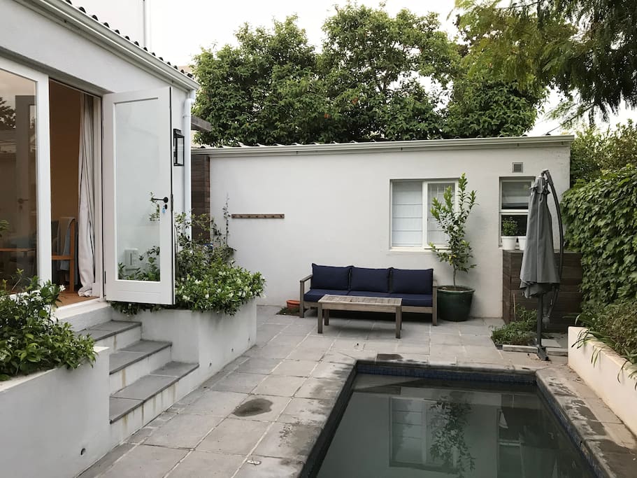 Pool area with French doors opening from bedroom. Pool area also accessed from the kitchen.