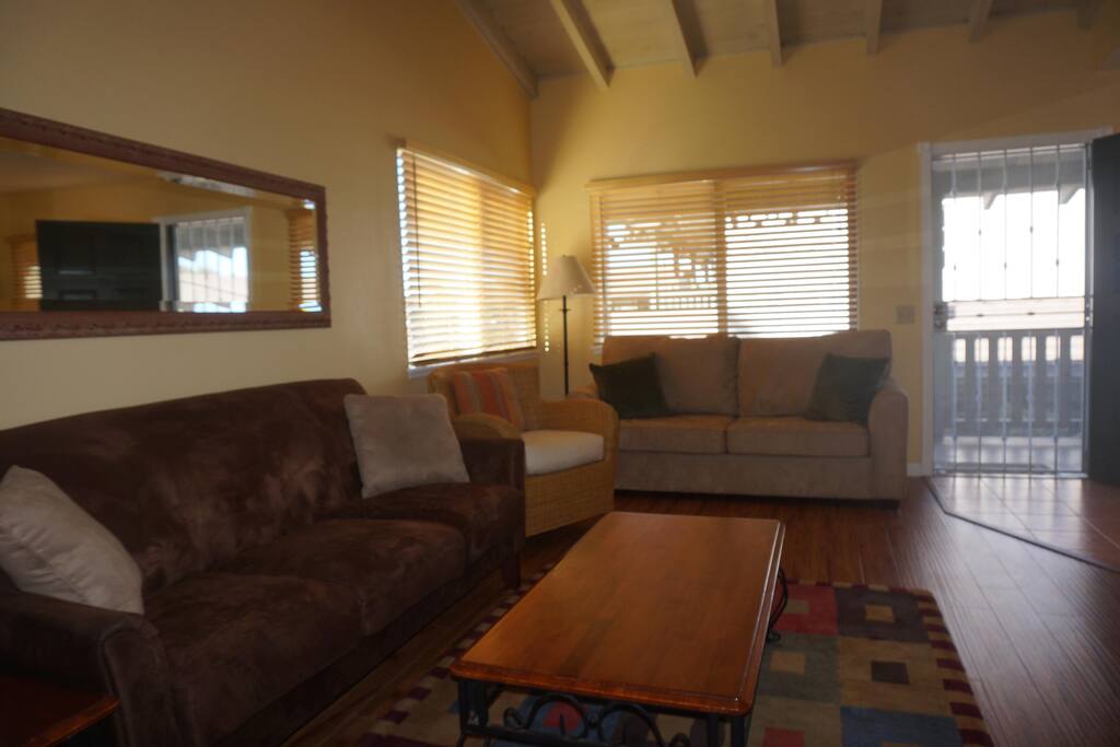 Light & spacious living room with vaulted celing