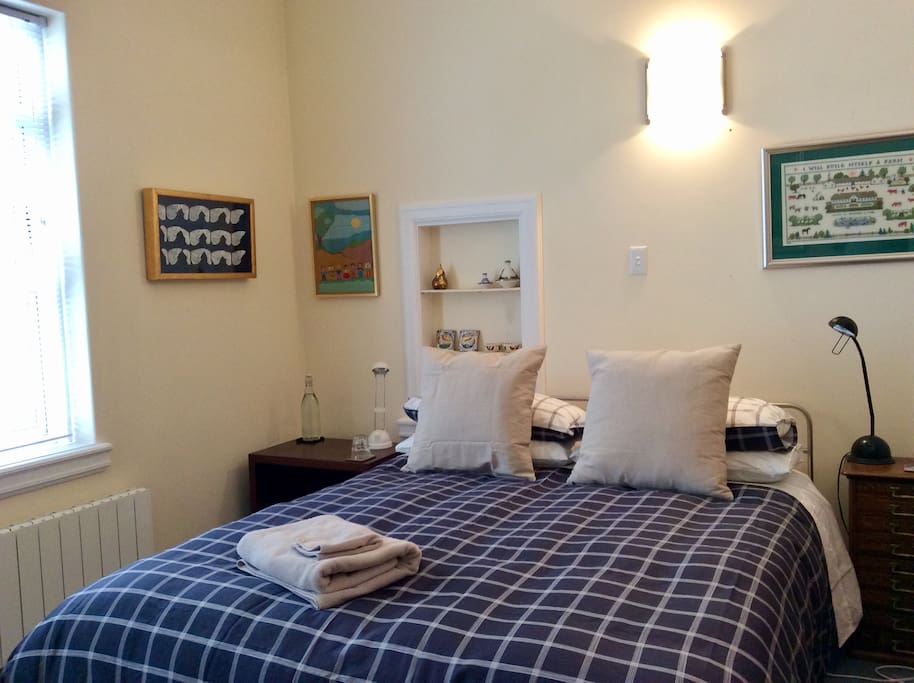 This is your lovely bedroom. The comfortable queen bed was made by a well known designer Bob McDonald