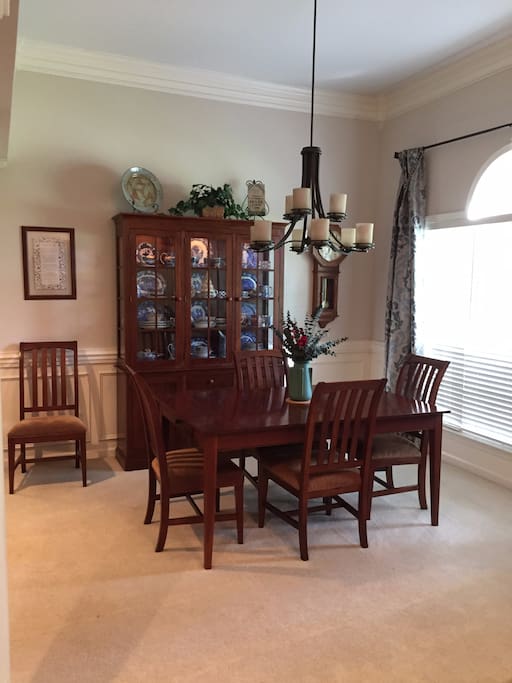 Open formal dining room adjoins living room; table extends to serve eight.
