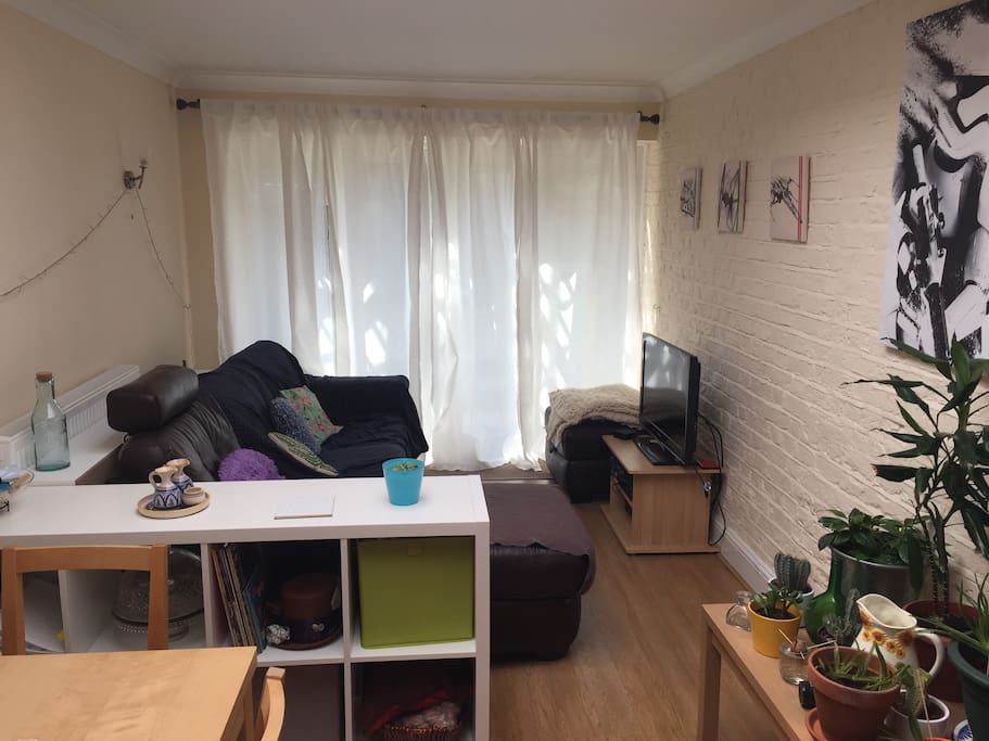 The living room is big and there's a lot of light coming through the garden doors and the skylight