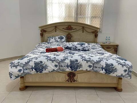 furnished private room in a villa just walking distance to al ain mall . the room has 2 king size bed suitable for groups travelers and has balcony