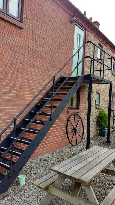 External staircase to upper flat