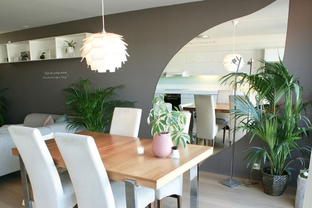 Close up on Living room dining table for breakfast with apple leaf mirror in the background.