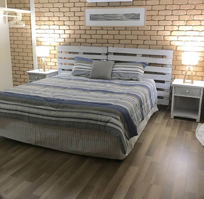 Master bed has huge comfy king bed with private balcony.