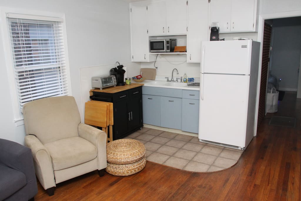 This small kitchenette is packed with everything you need: Keurig coffee maker (plus coffee and fixing's), microwave, toaster oven, full refrigerator, an air popcorn maker (popcorn included), and full set of plates/utensils/glasses/mugs.