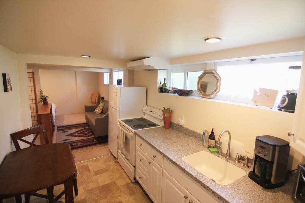 Full kitchen with utensils, cookware, coffee maker and basic spices to cook home made meals.