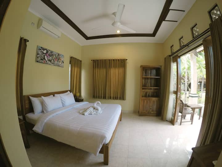 Private bedroom with air condition, fan, king size bed