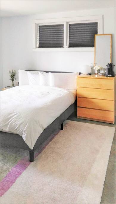 Comfy queen bed in a private bedroom. Multiple pillow choices: firm, soft, memory foam.