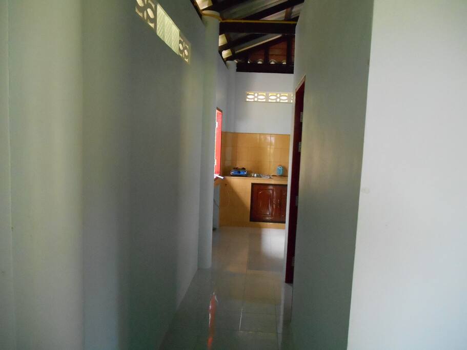 Hallway to the bedroom and kitchen
